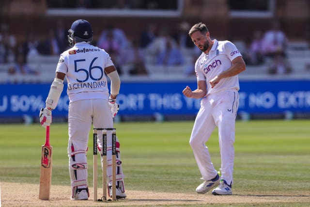 Chris Woakes celebrates after dismissing Dinesh Chandimal 