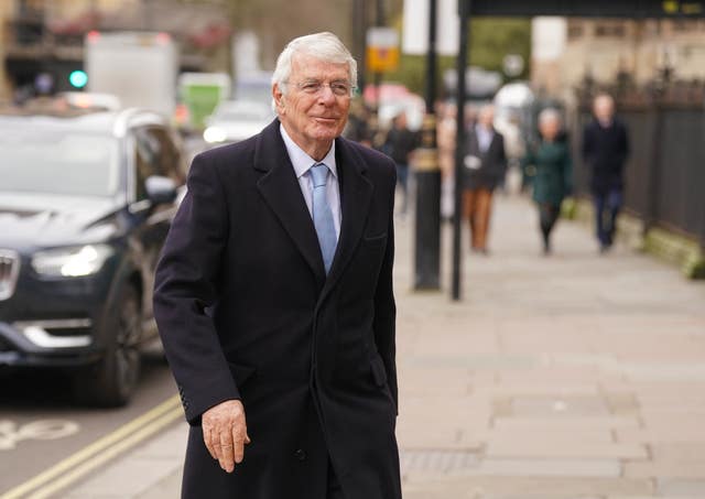 Former prime minister Sir John Major arriving for a memorial service for Lord Hoyle 