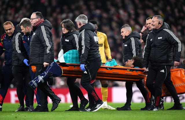 Medics carry Crystal Palace’s Chris Richards off the pitch