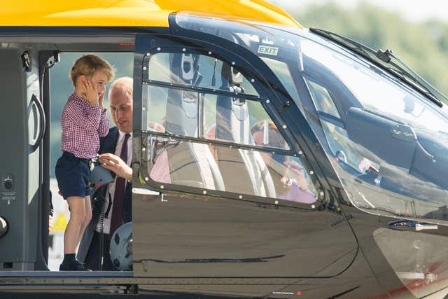 Prince George inside a rescue helicopter during a visit to Airbus in Hamburg on a royal visit to Germany