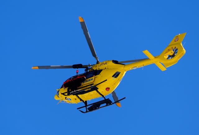 A helicopter takes Lindsey Vonn to hospital after falling in the women's downhill