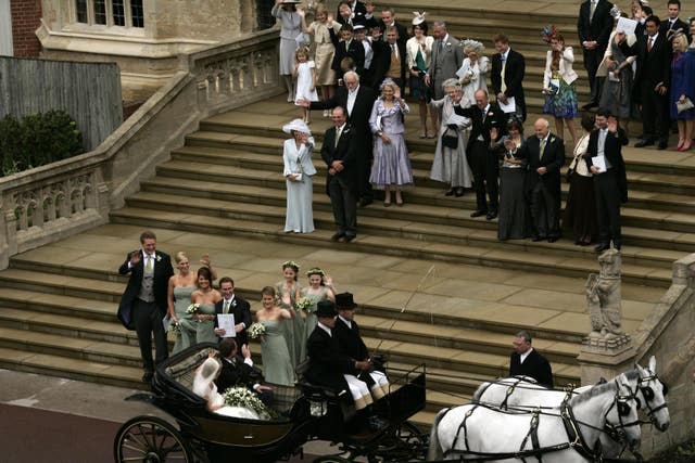 Peter and Autumn Phillips leave in a carriage after their wedding (Sang Tan/PA)