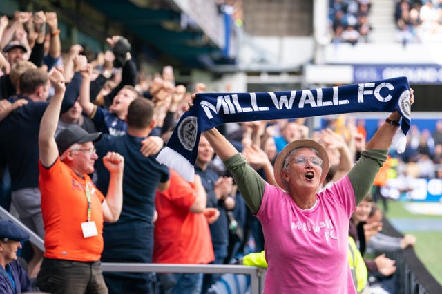 Millwall fans celebrate Jed Wallace's early goal in the 1-1 draw against QPR at the Kiyan Prince Foundation Stadium (Dominic Lipinski/PA).