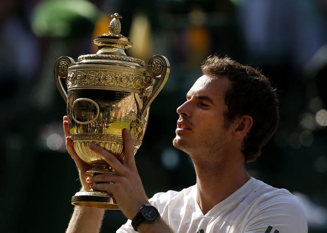 Andy Murray holds the Wimbledon trophy 