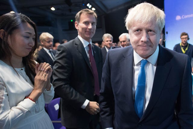 Jeremy Hunt watches as Boris Johnson is announced as the new Conservative Party leader