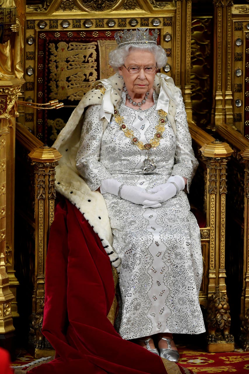 Queen Back In Royal Robes For ‘sham State Opening Express And Star