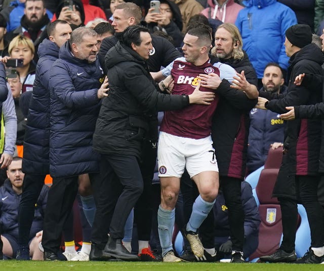 John McGinn, centre right, is ushered away by his manager Unai Emery after being sent off