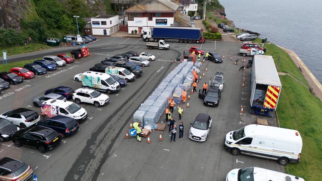 Bottled water being picked up at Freshwater car park in Brixham