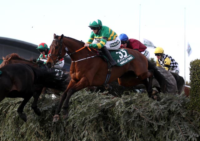 Minella Times powered over the famous fences 