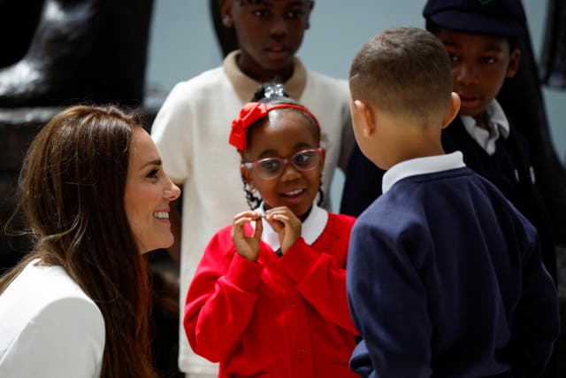 The Duchess of Cambridge speaks with children at the unveiling 