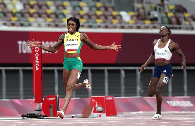 Thompson-Herah, left, wins gold in the 200m in Tokyo last year to complete her Olympic 'double double'