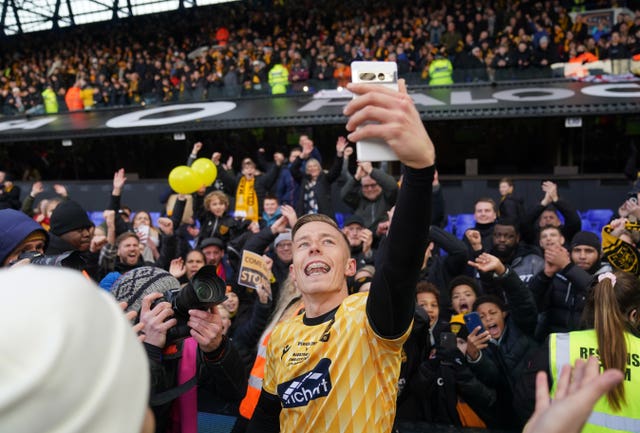 Maidstone United’s Sam Corne celebrates with the fans as the team celebrates the win after the Emirates FA Cup fourth round match at Portman Road.