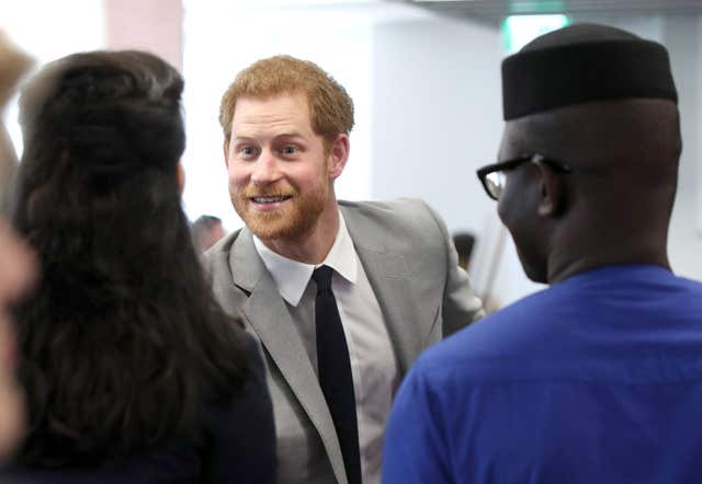 Harry shares a joke with delegates (Yui Mok/PA)