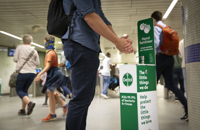 A dettol hand sanitiser point in a tube station