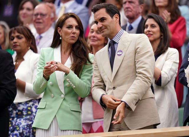 The Princess of Wales (left) alongside Roger Federer in the Royal Box at Wimbledon 