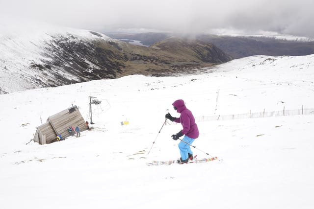 A skier makes their way down the slope at the Lake District Ski Club 