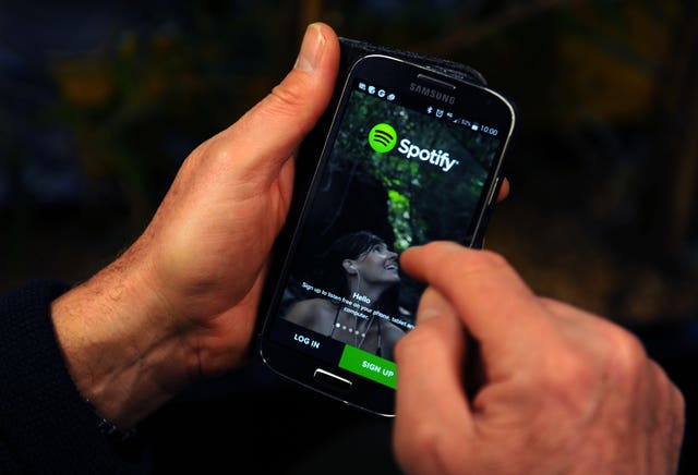 The Spotify App is shown on a Samsung smartphone
