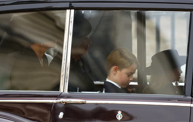 From left: The Princess of Wales, the Queen Consort, Prince George and Princess Charlotte arrive for the Queen's funeral