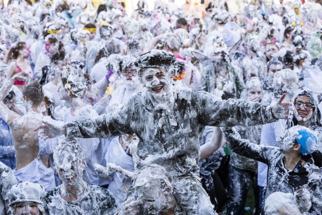 Laughing students covered in foam