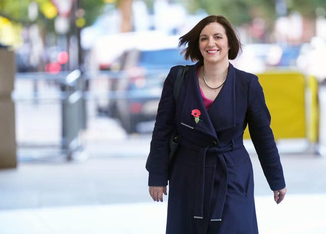 Bridget Phillipson dressed in coat, walking outside