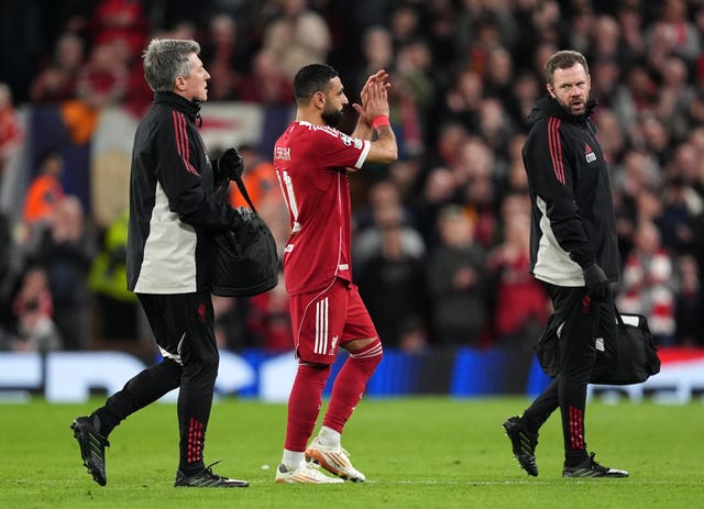 Liverpool’s Mohamed Salah applauds the fans as he leaves the game with an injury