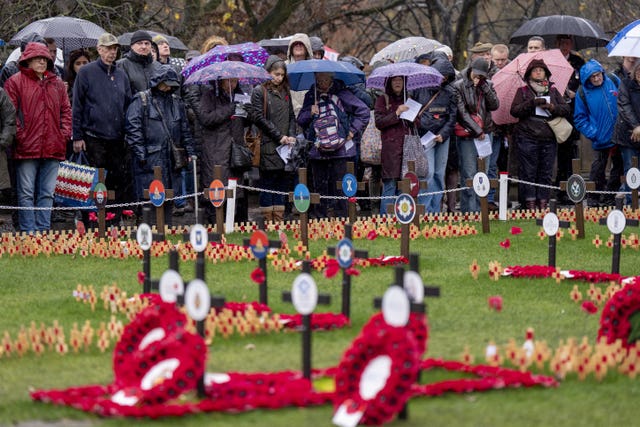 Members of the public during the Armistice Day event at the Scott Monument, in Princes St Gardens, Edinburgh