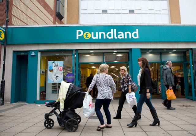 View of a group of women shoppers outside a Poundland branch