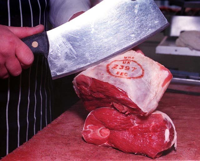 A joint of lamb being prepared in a York butcher's (John Giles/PA)
