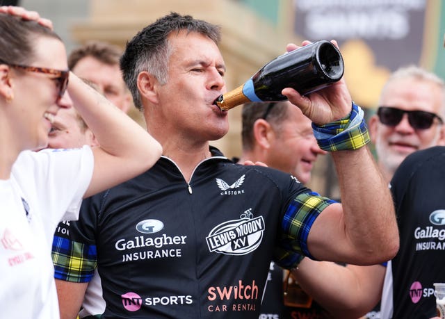 Kenny Logan celebrates after completing the Lewis Moody XV Cycle Challenge ahead of the Gallagher PREM Final at the Allianz Stadium, London