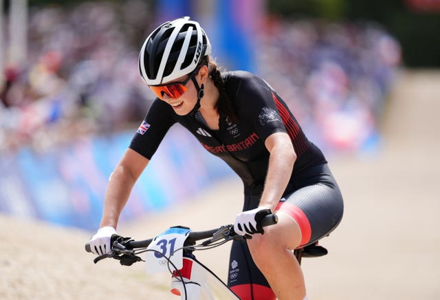 British teenager Ella Maclean-Howell grimaces as she takes on the mountain bike challenge. 