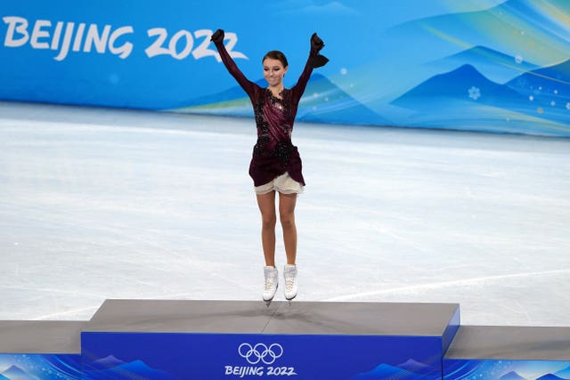 Anna Shcherbakova celebrates on the podium in Bejing