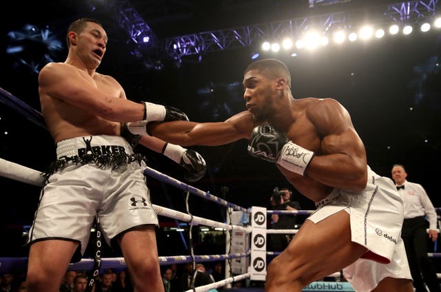 Joshua, right, lands a body shot