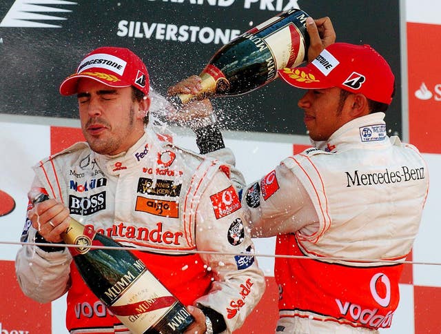 McLaren-Mercedes team-mates Fernando Alonso, left, and Lewis Hamilton enjoyed themselves on the podium in 2007. The pair had to settle for second and third place respectively after eventual world champion Kimi Raikkonen came out on top