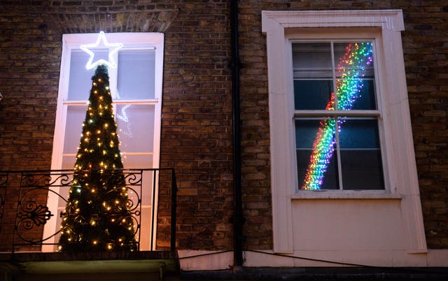 A display of rainbow coloured Christmas lights appears on Motcomb Street in Belgravia