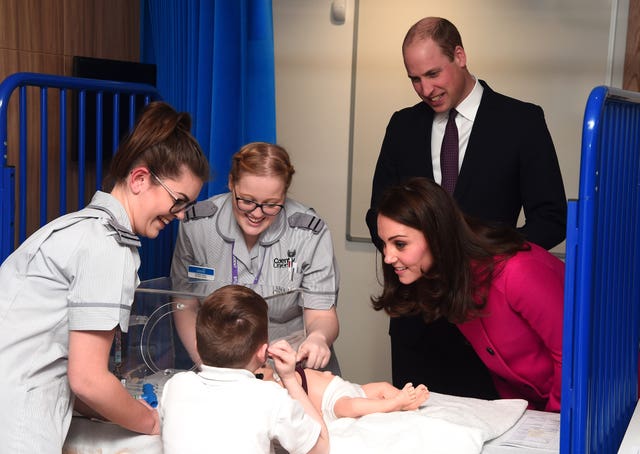 The Duke and Duchess speak to staff as they tour the Science and Health Building at Coventry University (Eamonn M McCormack/PA)