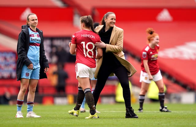Manchester United manager Casey Stoney celebrates after the match 