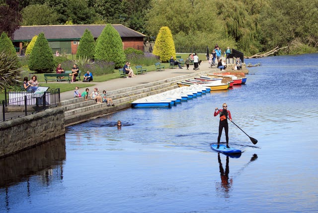 A paddleboarder enjoys the sun on the River Wharfe near Otley in West Yorkshire