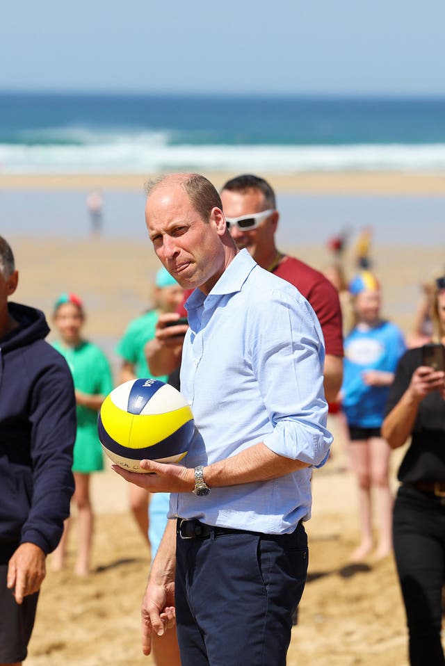 Prince William takes part in a game of volleyball during a visit to Fistrall beach in Newquay (Toby Melville/PA)