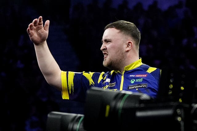 Luke Littler gestures towards Gian van Veen