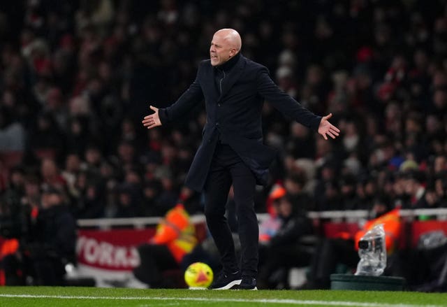 Liverpool head coach Arne Slot stands on the touchline with his arms outstretched