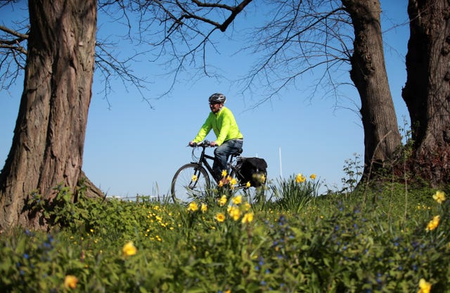 A cyclist gets their daily exercise in Stoke Park, Guildford (Adam Davy/PA Wire)