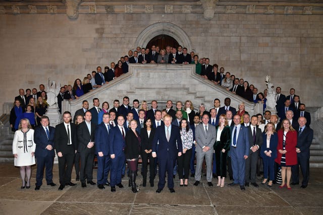 Prime Minister Boris Johnson alongside the newly elected Conservative MPs at the Houses of Parliament in Westminster