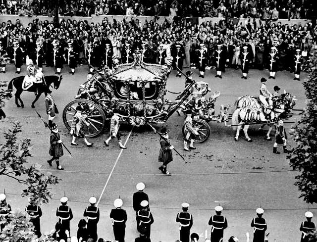 The coach carrying The Queen and Duke of Edinburgh on her coronation day in 1953 