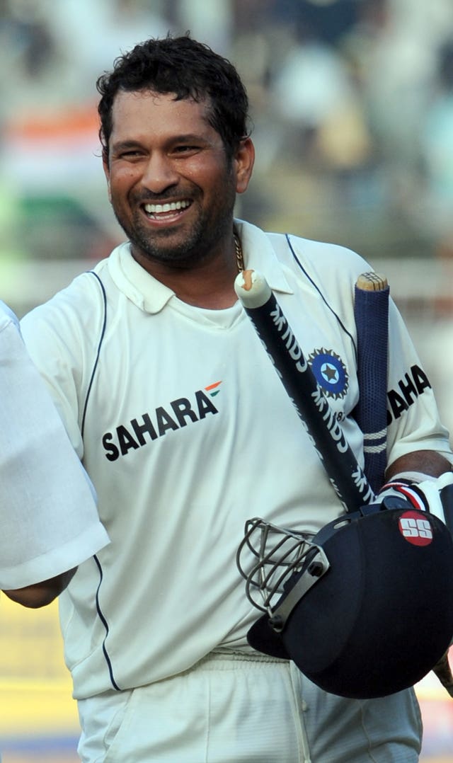 Sachin Tendulkar smiles as he celebrates a Test win for India