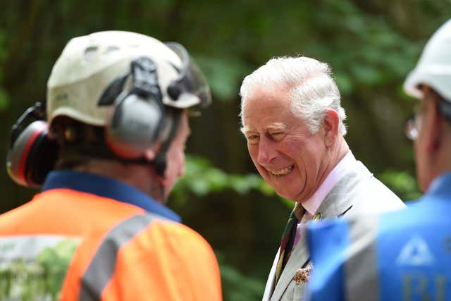 Charles meets people at the facility