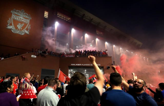 Liverpool fans celebrate outside Anfield 