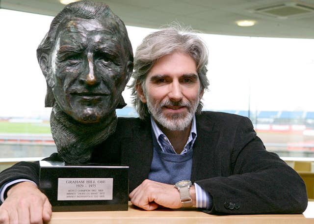 Damon Hill with a bust of his father, Graham, who like him also won the Formula One world title