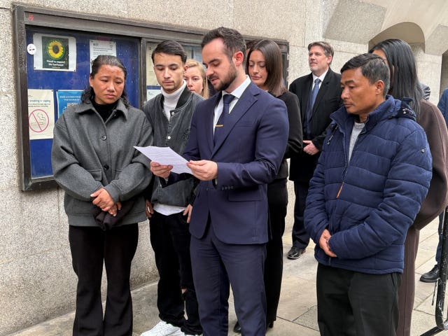Cameron Vincent, from Leigh Day solicitors, making a statement outside the Old Bailey, London, on the behalf of parents Sharmila Tamang (far left) and Bikash Tamang (far right)