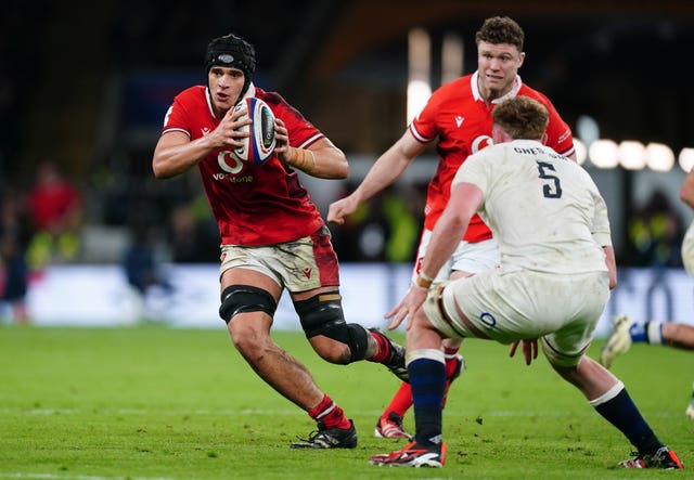  Dafydd Jenkins runs with the ball while playing for Wales against England