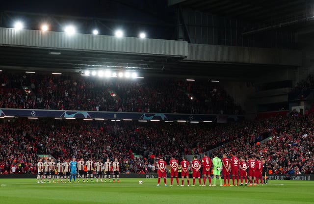 Liverpool and Ajax players, officials and fans observe a minute’s silence in memory of the Queen 